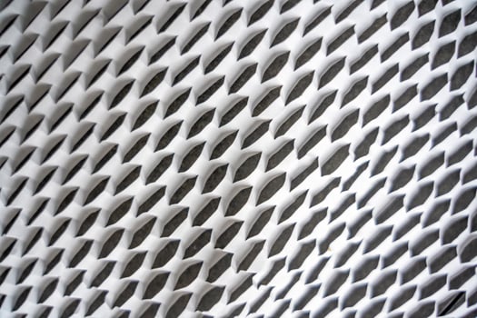 Texture of corrugated white paper for safe transportation, in which the goods brought by the courier delivery service are wrapped, environmental packaging concept. Ecological background. photo