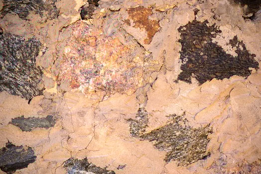 Detailed image showcasing the textured cracks and peeling layers of an aged, weathered wall photo