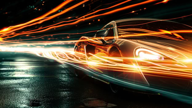 Extreme closeup of a light trail forming behind a car as it comes into focus. The intensity of the light is almost blinding against the dark background photo