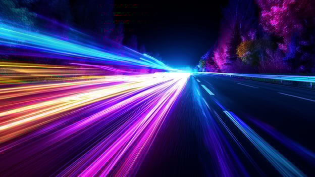Intense bursts of purples blues greens and yellows create a kaleidoscope of color as the light trails race along the black pavement of Rainbow Road Rush photo