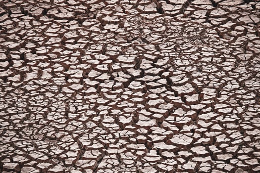 Cracked Dry Earth Texture - Drought and Climate Change Concept - Parched Soil Background photo