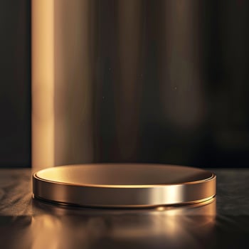 A golden plate on a table with a light shining on it photo