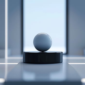 A ball on top of a table in front of a window photo