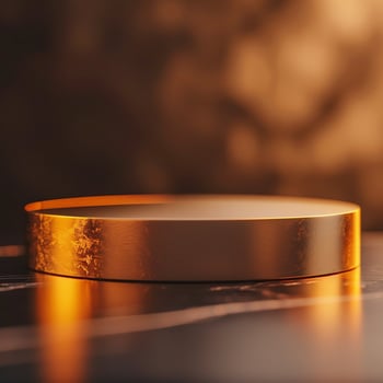 A golden round table with a black background photo