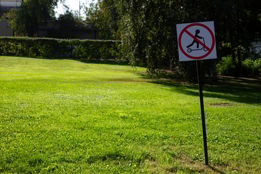 Special sign for rules in public park prohibiting riding electric scooters. Traffic regulation on the streets of a modern city. No allow scooter photo
