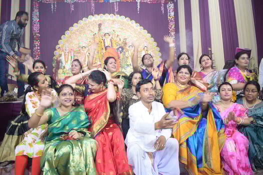 Delhi, India, July 02,2024 - Devotees performing spiritual dance in front of Durga Idol, Durga Puja celebration at Kali Bari temple in Jhilmil Colony Delhi, Durga utsav festival in Oct 2023 photo