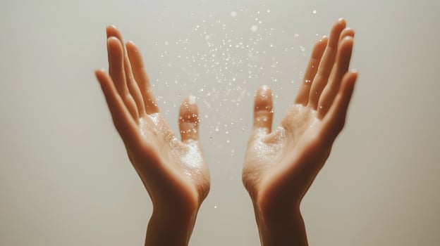 Sweaty hands with water droplets splashing around them. photo