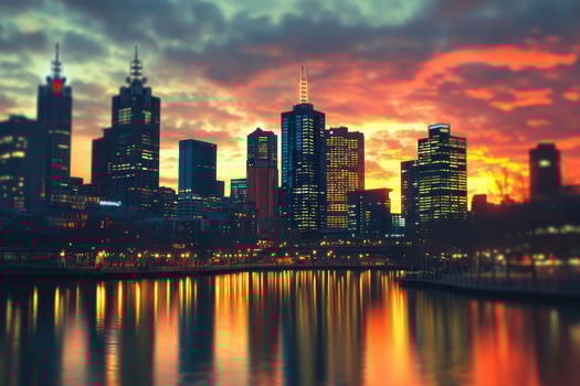 Melbourne skyline illuminated by sunset reflections over Yarra River in evening twilight photo