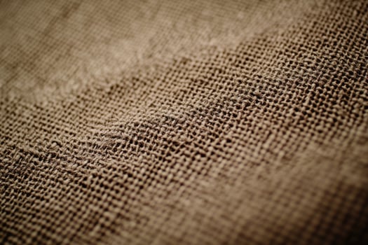 Textured natural burlap fabric close-up in soft natural light photo