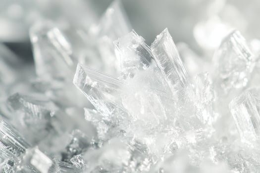 Delicate ice crystals sparkle under natural light during a winter morning in a frozen landscape photo