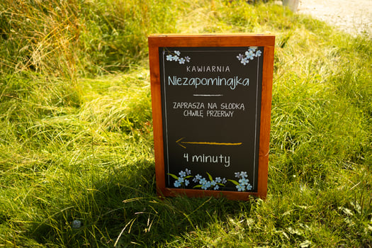 Blank menu blackboard outdoor display for the coffee shop cafe, mock up, cafeteria blurred background photo