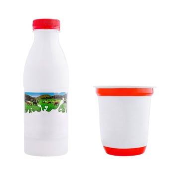 White plastic bottle and yogurt cup standing on white background photo