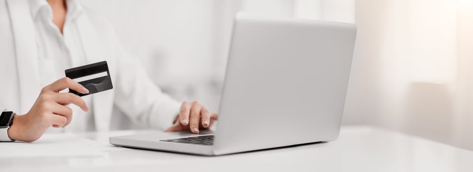 Sharing Is Caring. Unrecognizable woman making donation, female hands holding credit card, using computer, copyspace photo