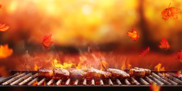 Host a delightful autumn barbecue with a variety of grilled meats, surrounded by vibrant leaves, creating memorable gatherings in the cozy atmosphere of this enchanting fall season photo