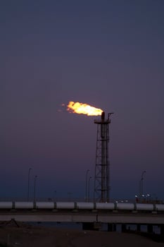 Coastal Regasification Plant Flare at Dusk in Huelva, Andalusia photo