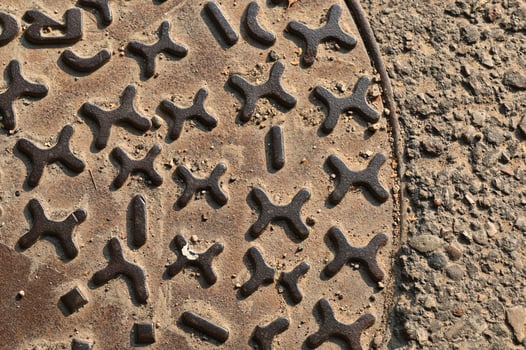 a manhole cover with a bunch of numbers on it photo
