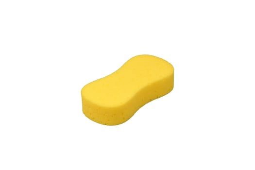 Isometric macro photography of yellow washing sponge isolated on white background photo