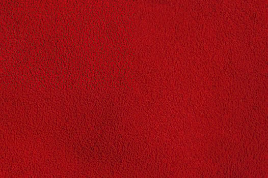 Red suede background macro photo. Suede texture. photo