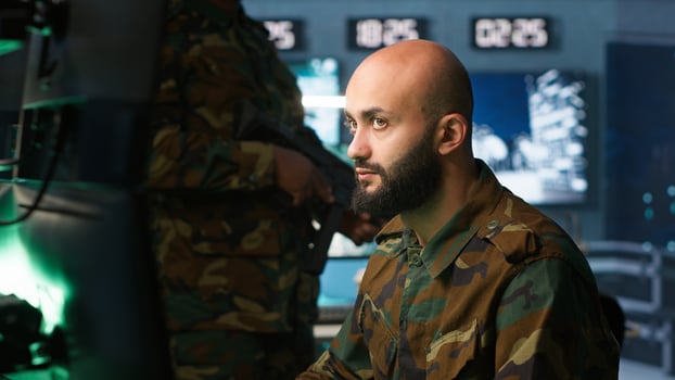 Military officers checking weapons in control room, ensuring bullets and supplies are properly and evenly distributed. Soldiers managing combat load equipment before warfare assault mission, camera A photo