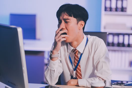 Businessman workaholic sit at the computer working late at night yawn tired and sleeping in the office,Hard work in the later time concept photo
