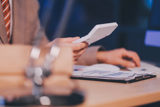 Business accounting concept Businessman uses calculator with laptop computer Budget and borrowed paper Calculate expenses, expenses, taxes online, manage company budgets, close-up images photo