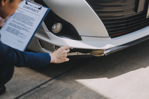 A young businesswoman is navigating car insurance options at her desk, considering premiums, deductibles, and coverage while understanding policies and managing claims efficiently. photo