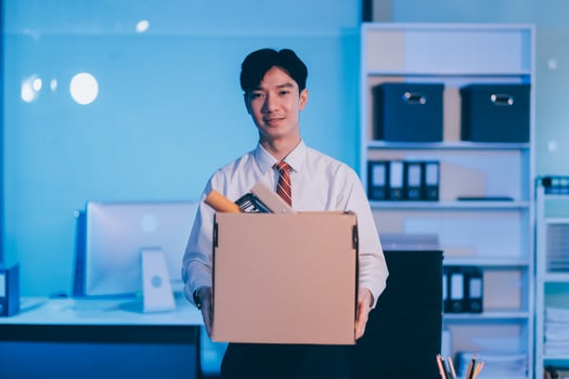 lose job, Your fired. Unhappy business man with surgical medical mask going out with cardboard, looking at camera and feeling looser. indoor shot. business, working and health care concept. photo