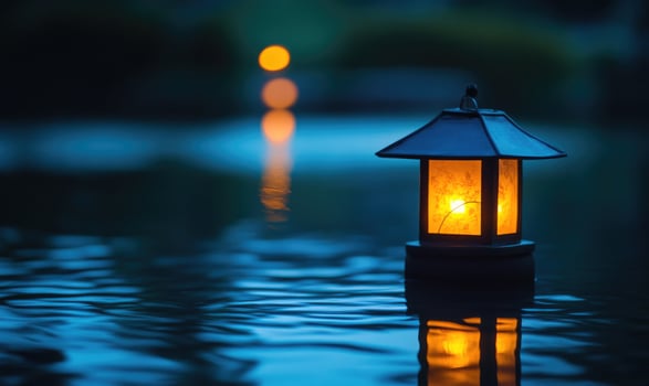 Close-up of a single floating lantern, glowing brightly in the night photo