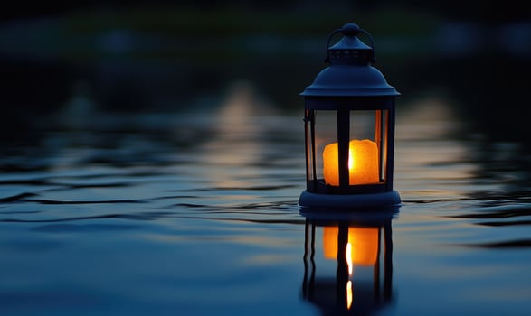 Close-up of a single floating lantern, glowing brightly in the night photo