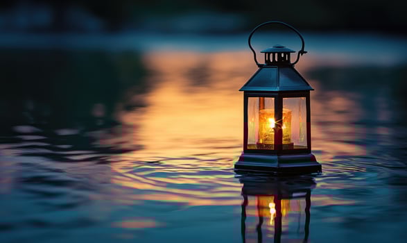Close-up of a single floating lantern, glowing brightly in the night photo