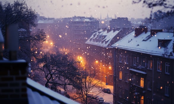 A snowy city street with lights on and snow falling photo