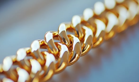 A gold chain with a shiny surface photo