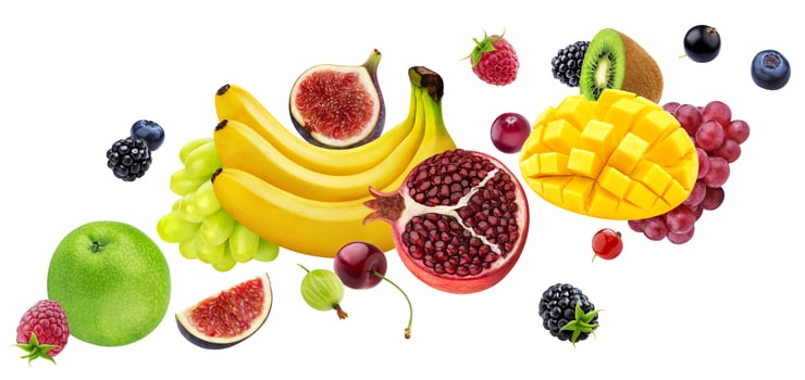 Falling fruits and berries isolated on white background photo