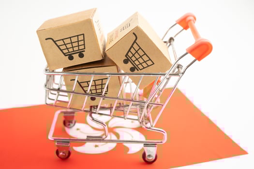 Box with shopping online cart logo and HongKong flag, Import Export commerce finance delivery trade. photo
