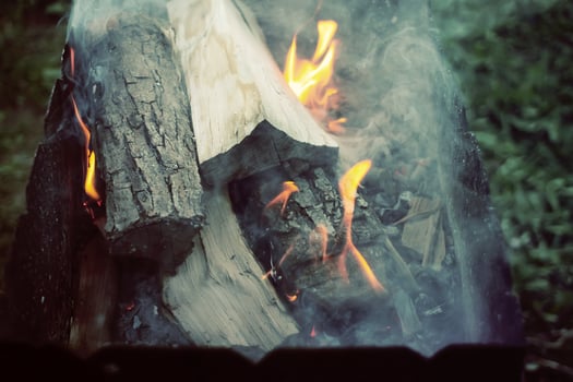 Burning firewood in the fireplace closeup photo