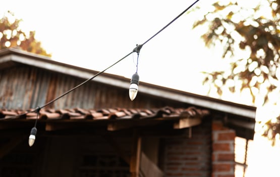 A light bulb hanging from a wire photo