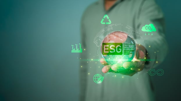Businessman holding globe with ESG icon green earth concept for environment Society and Governance sustainable environmental concept of the world, Green business natural environment, Save earth. photo
