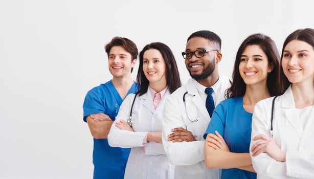 Young Professional Doctors Standing Together In Laboratory, Posing With Crossed Arms photo