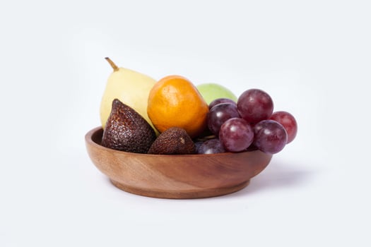 Assortment of exotic fruits isolated on white background. Close up of heap of fruit. Concept of healthy eating and dieting lifestyle. photo