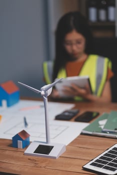 Female architect working at home She looked at the blueprint. photo