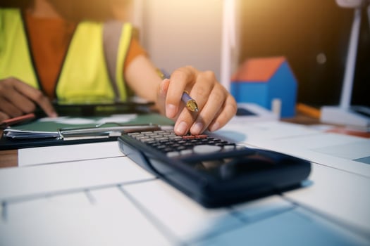 Female architect working at home She looked at the blueprint. photo
