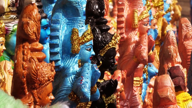 Colorful mythological sculptures displayed in a handicraft shop photo