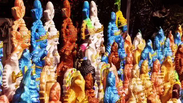 Colorful mythological sculptures displayed in a handicraft shop photo