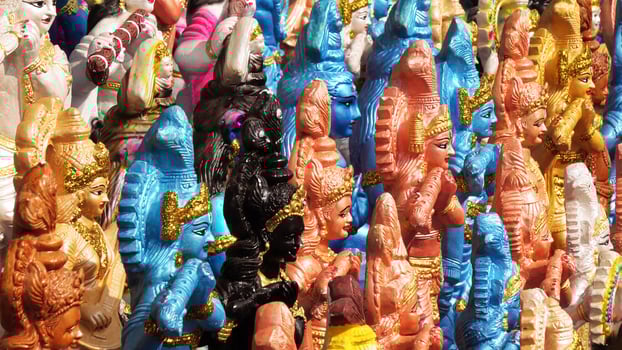 Colorful mythological sculptures displayed in a handicraft shop photo