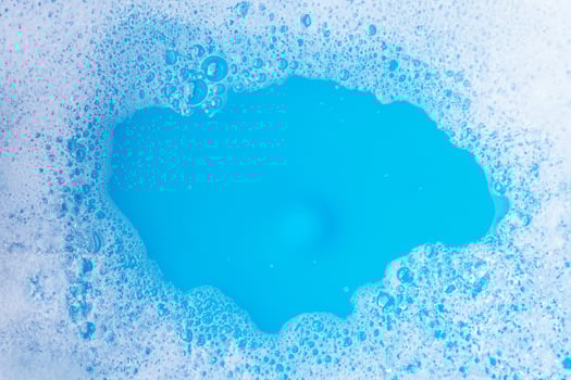 Blue Background with Detergent Foam Bubble photo