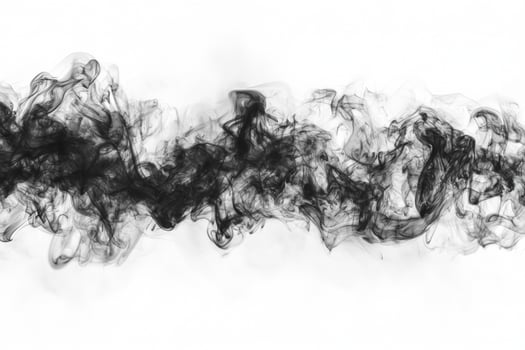 Thick, dark smoke flows horizontally against a bright white surface, showcasing intricate patterns and dramatic edges, creating a striking visual effect. photo