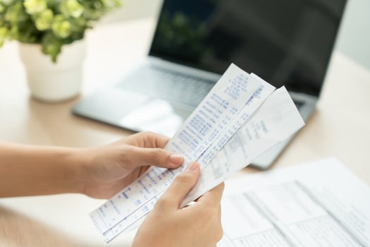 Stressed and headache man with large bills or invoices no money to pay to expenses and credit card debt. shortage, Financial problem, bankruptcy, mortgage, loan, bankrupt, poor, empty wallet photo