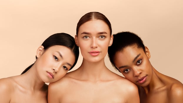 Female Beauty. Three Multiracial Women Looking At Camera Posing In Studio On White Background. Isolated, Panorama photo