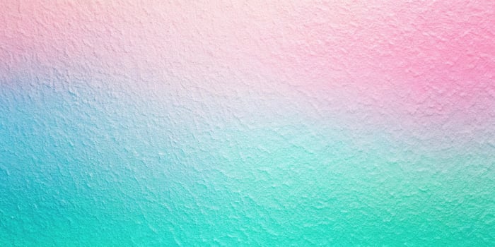Abstract pastel background with a gradient texture in light pink, blue, and green colors, viewed from a low angle photo