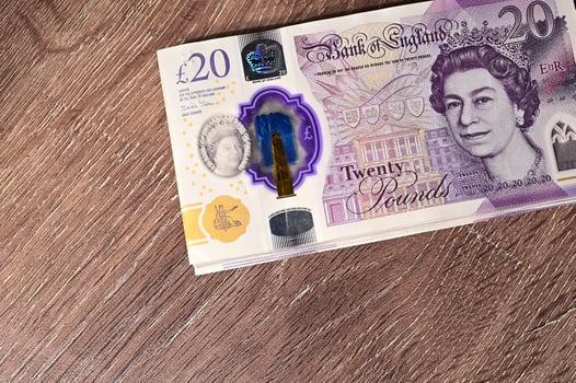 20 pound sterling bank notes closeup view business background photo